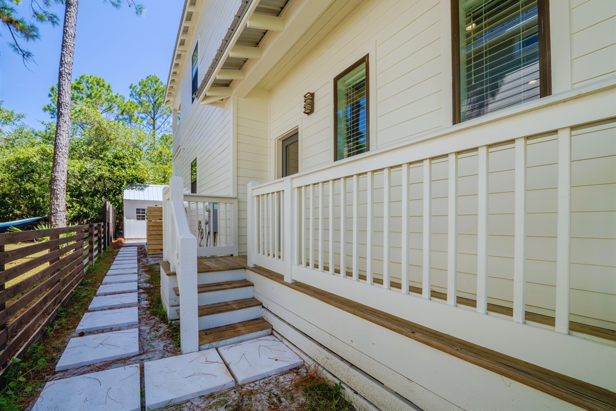 Side entrance to the house, conveniently located next to the outdoor shower for easy access