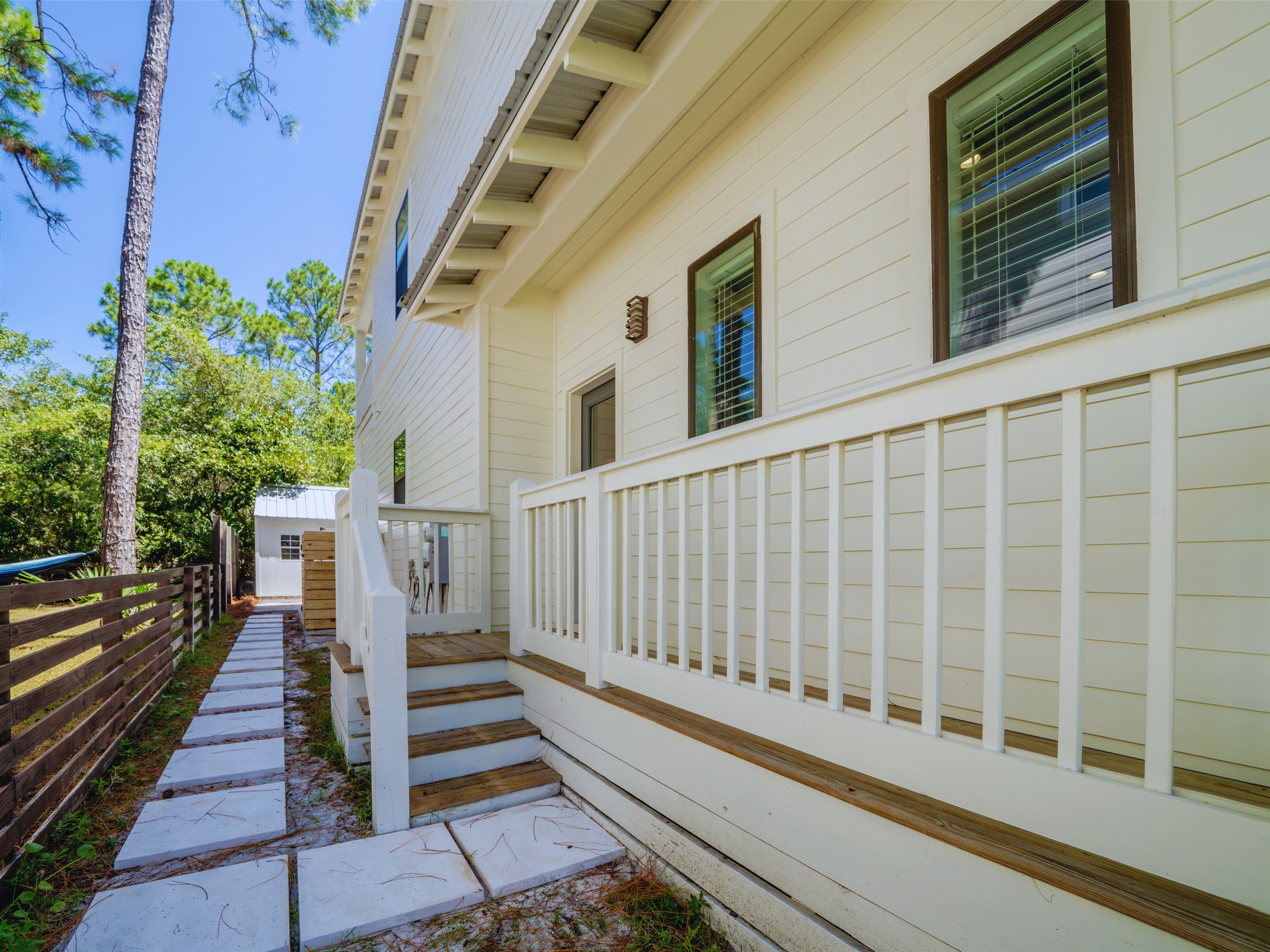 Side entrance to the house, conveniently located next to the outdoor shower for easy access