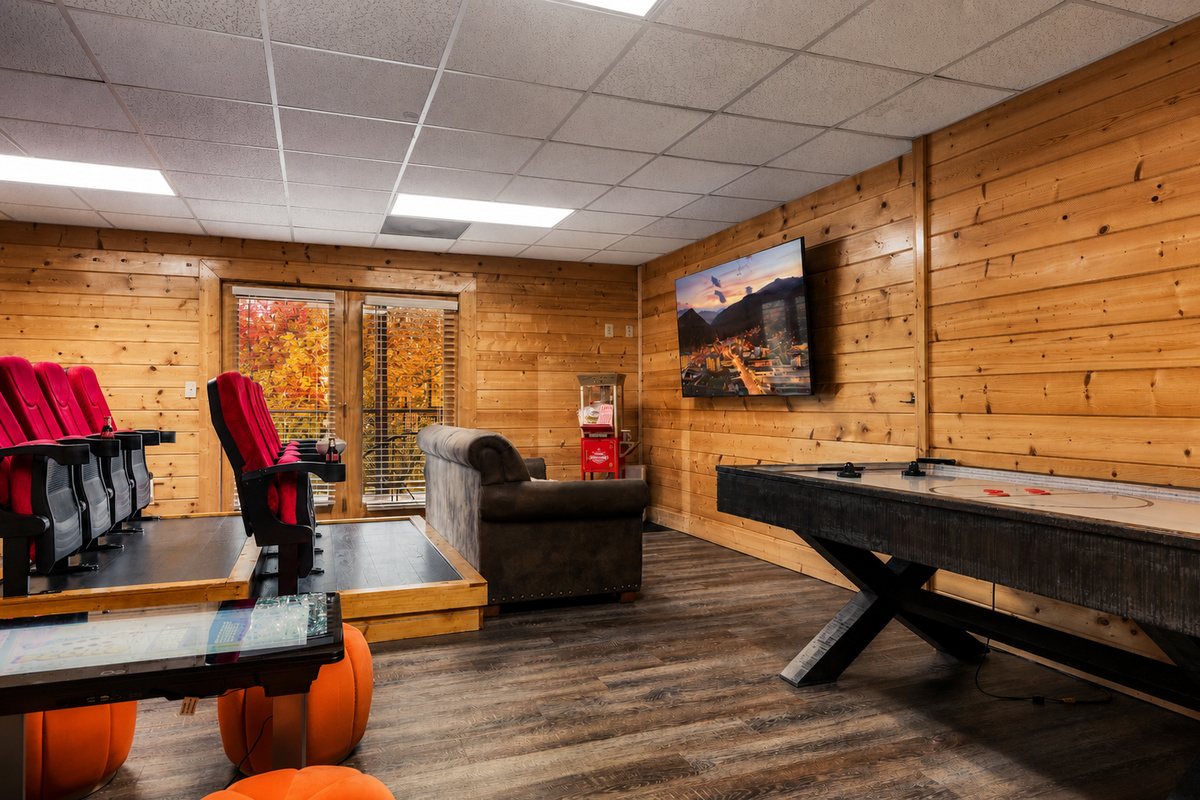 Theater room features a queen sleeper-sofa for additional guests.