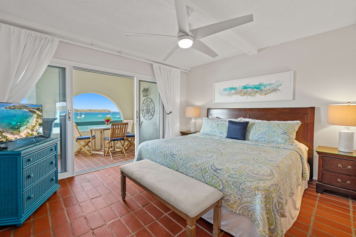 A peaceful primary retreat offering plenty of space to relax after a day at the beach.