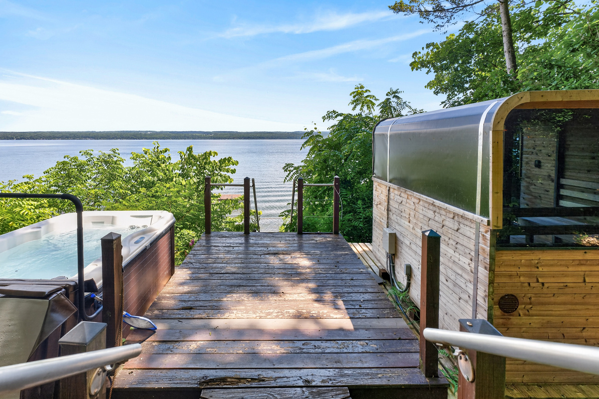 Sauna and hot tub on the lakeside deck