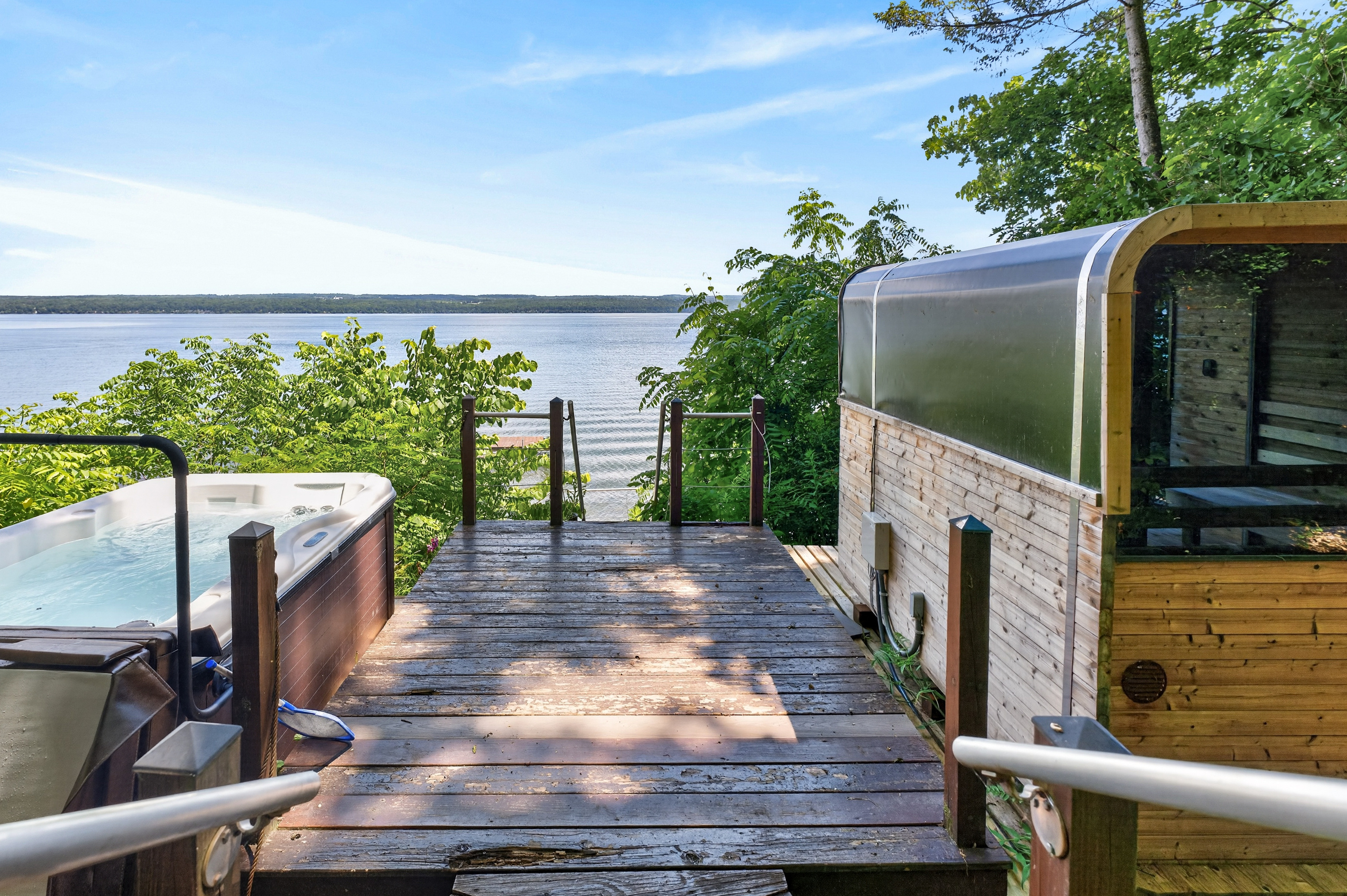 Sauna and hot tub on the lakeside deck