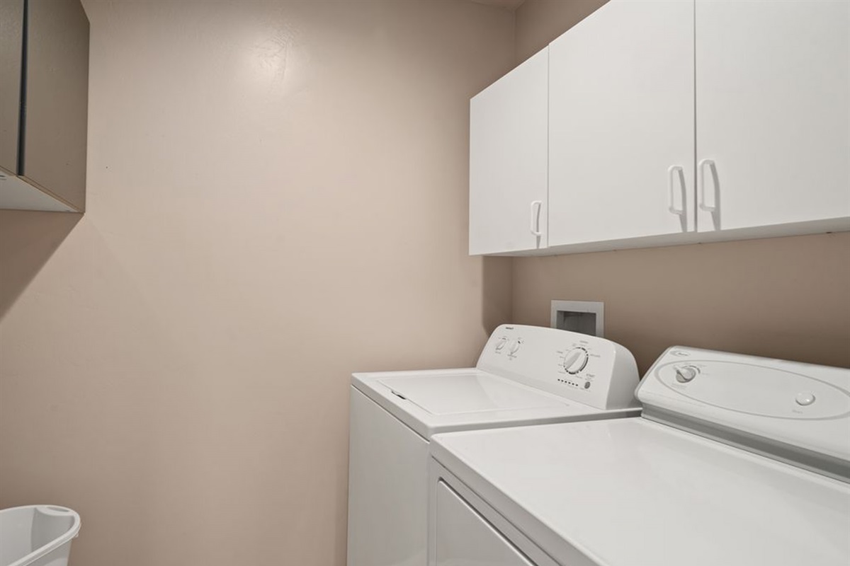 Convenient laundry room with washer and dryer for extended stays.