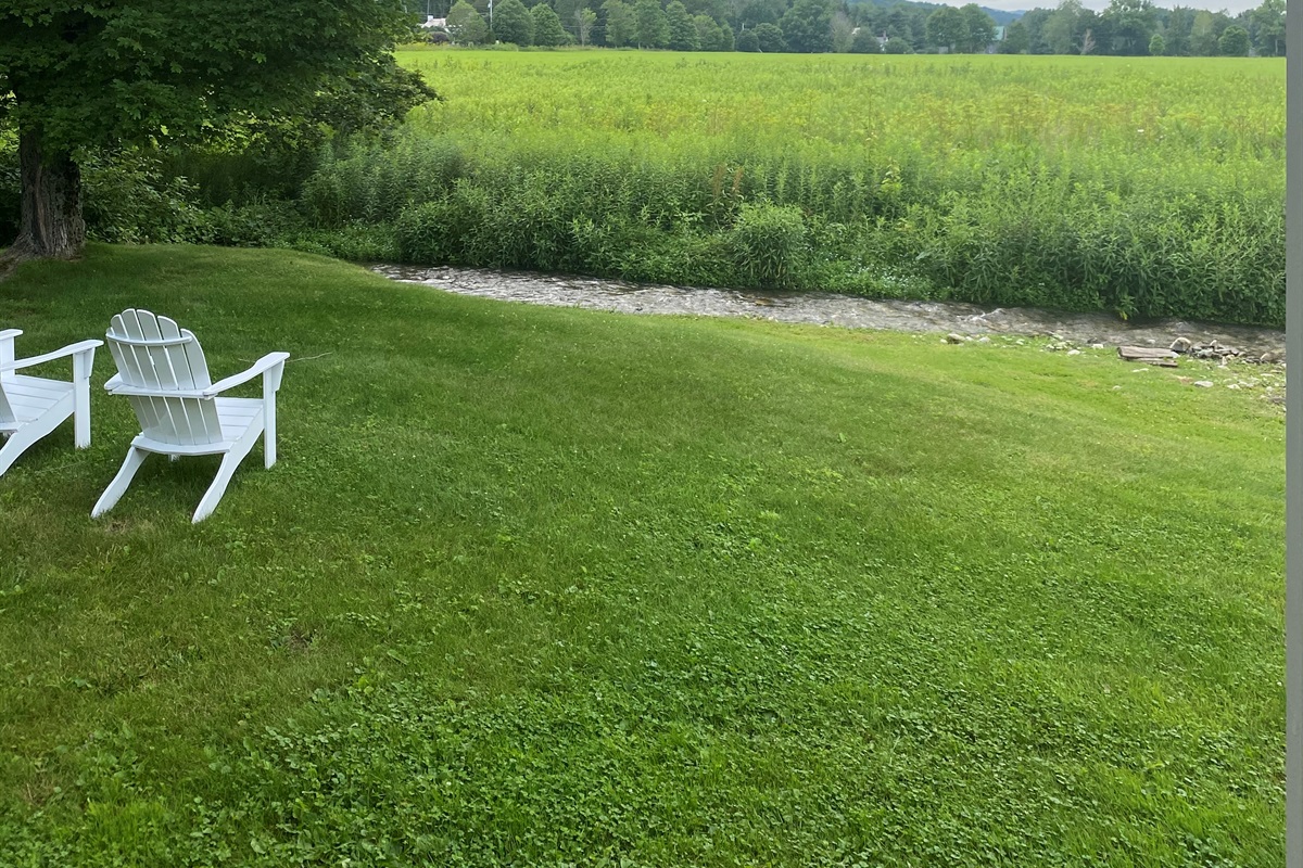 Open Lawn & Seating

“Expansive green lawn with Adirondack chairs — perfect for quiet mornings or sunset views.”