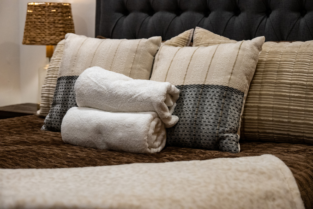 Soft linens and fresh towels are ready to welcome you after a day of adventure.