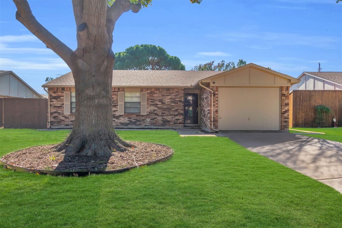 Welcome to your The Colony retreat, featuring a manicured front lawn and spacious driveway for convenient parking. A quiet, family-friendly neighborhood just minutes from Grandscape.
