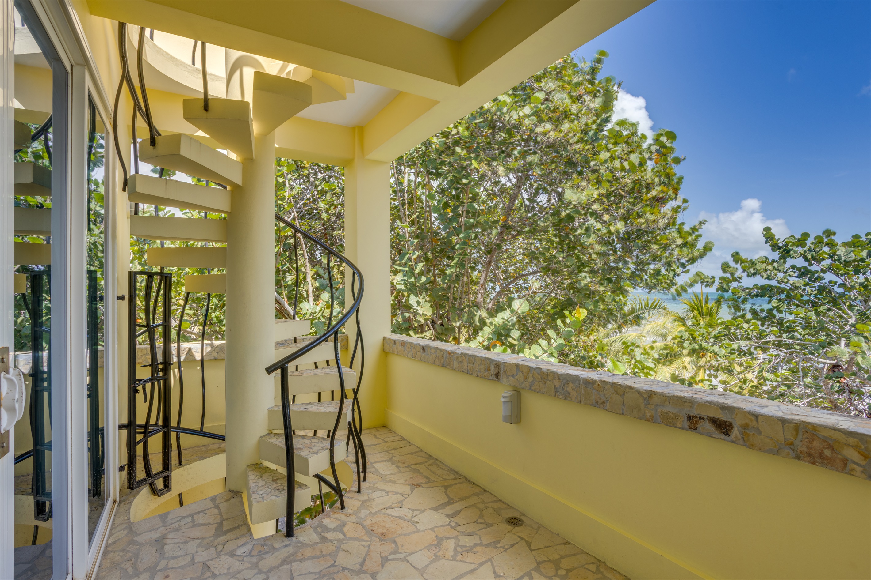 Bedroom Balcony spiral staircase to Roof top and first floor.