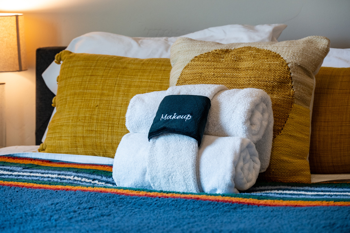 Sink into bed with premium linens and fresh towels, thoughtfully prepared for your stay.