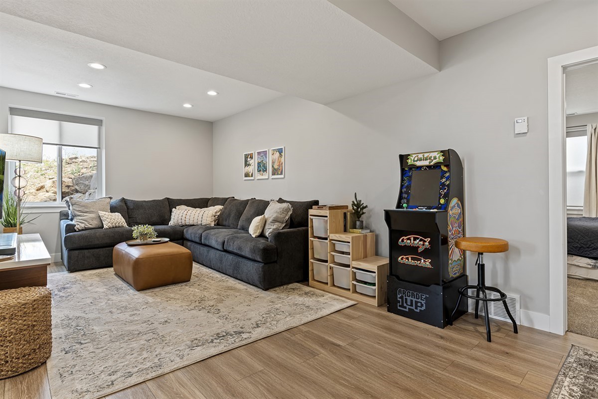 Bonus living space with arcade games and comfortable lounge seating