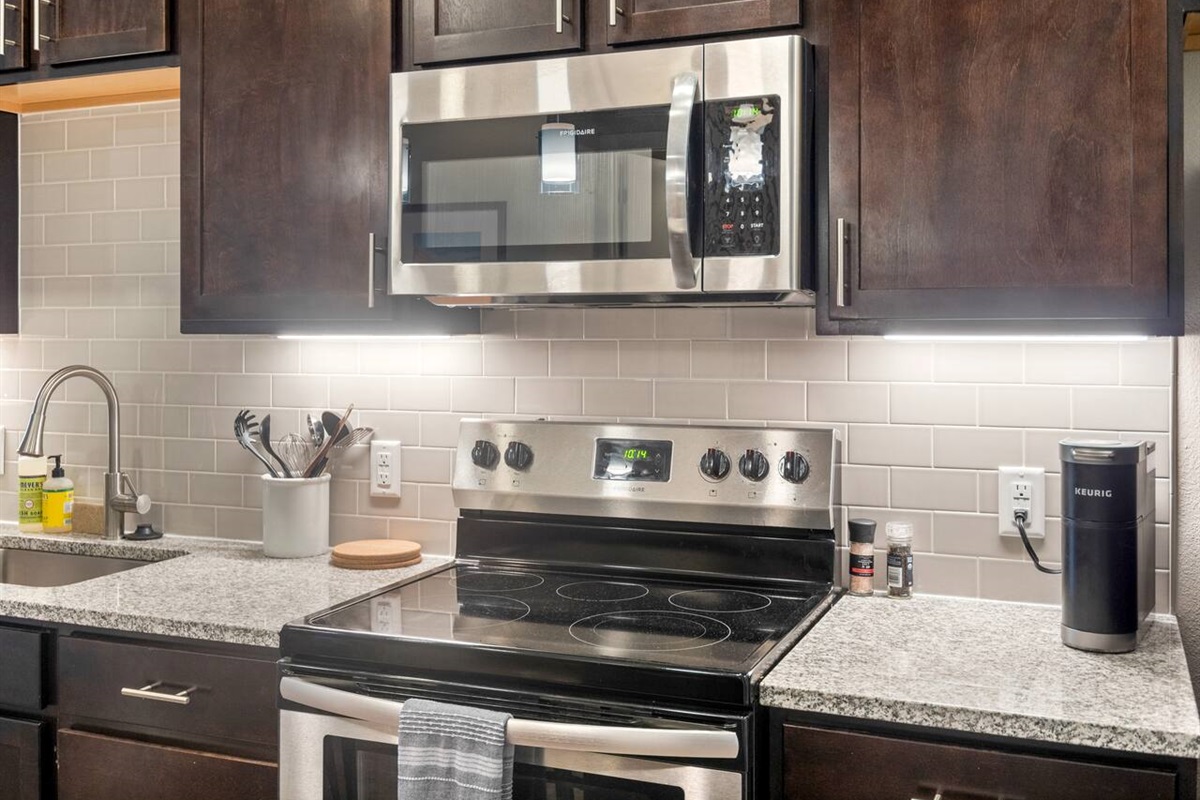 Fully stocked kitchen, complete pots, pans, utensils, spices, a Keurig and Keurig pods.