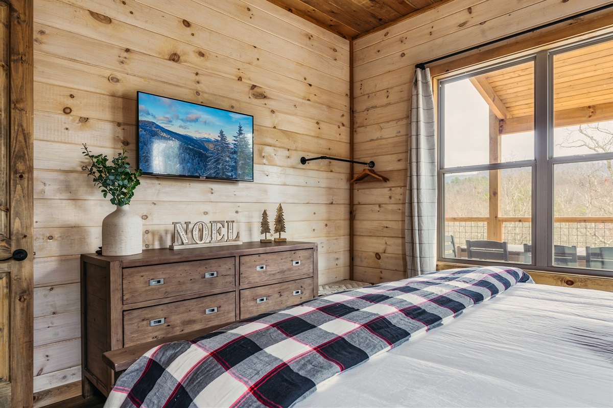 The main level suite also has a TV and dresser.