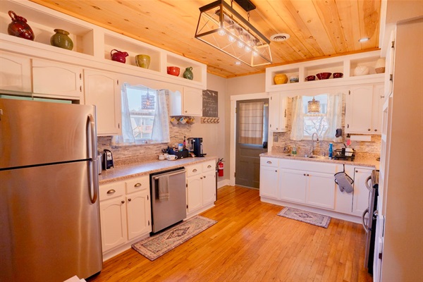 Fully stocked, family-friendly kitchen with modern appliances, plenty of counter space, and everything you need to cook meals or snacks together after a day of exploring Pigeon Forge.