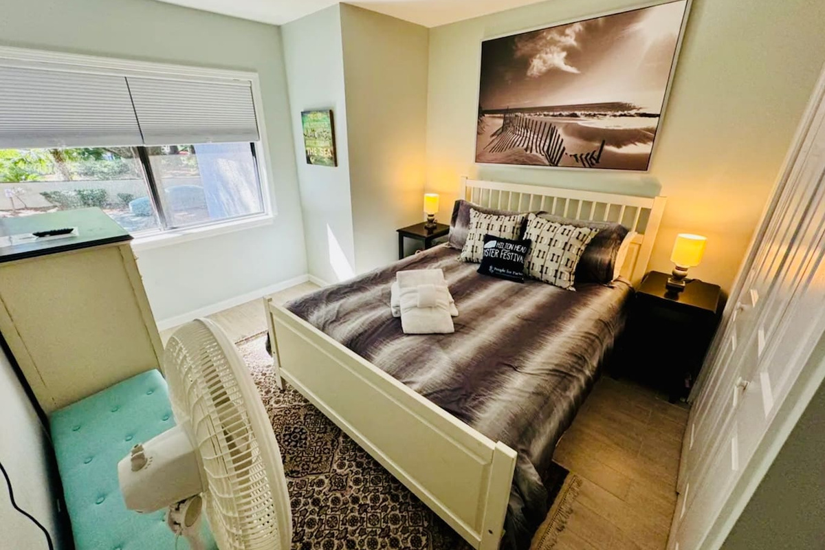 Bedroom with coastal art