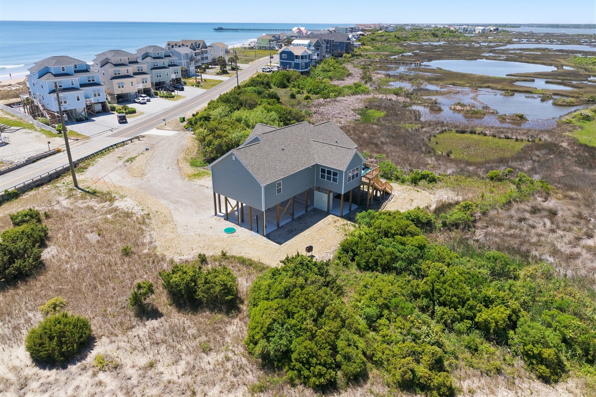 Best of both worlds: steps to the beach with stunning marsh views behind the home