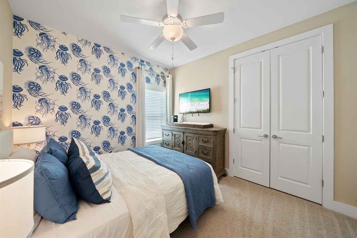 Queen Bed, changing station and travel crib in the closet.