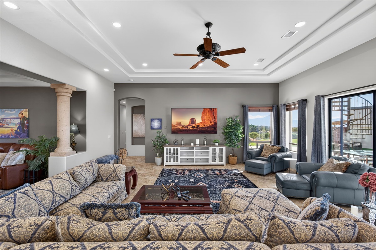 Spacious great room with comfortable seating, large TV, and open layout ideal for movie nights and group connection