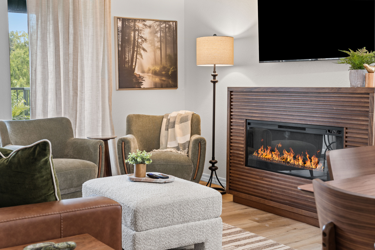 The electric fireplace adds atmosphere without the work of hauling or storing firewood.