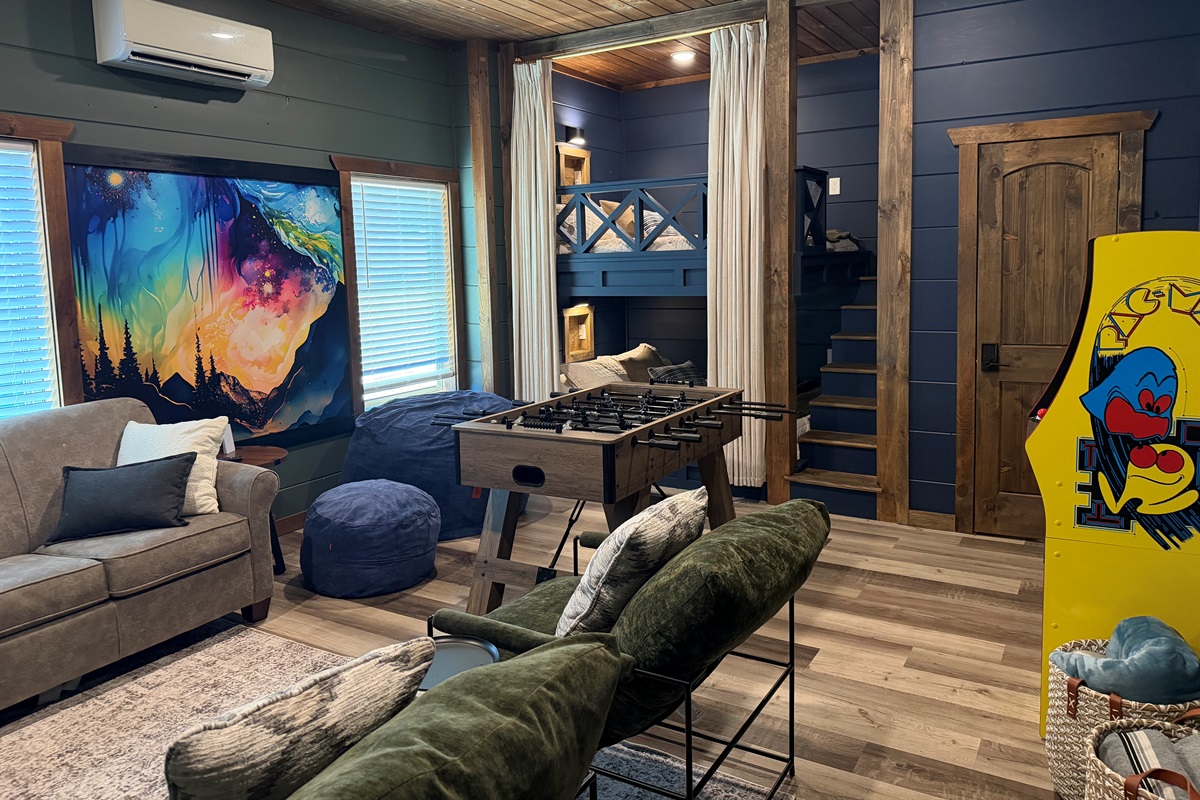 Recreation room with built-in Queen bunk beds, foosball, beanbag and smartTV