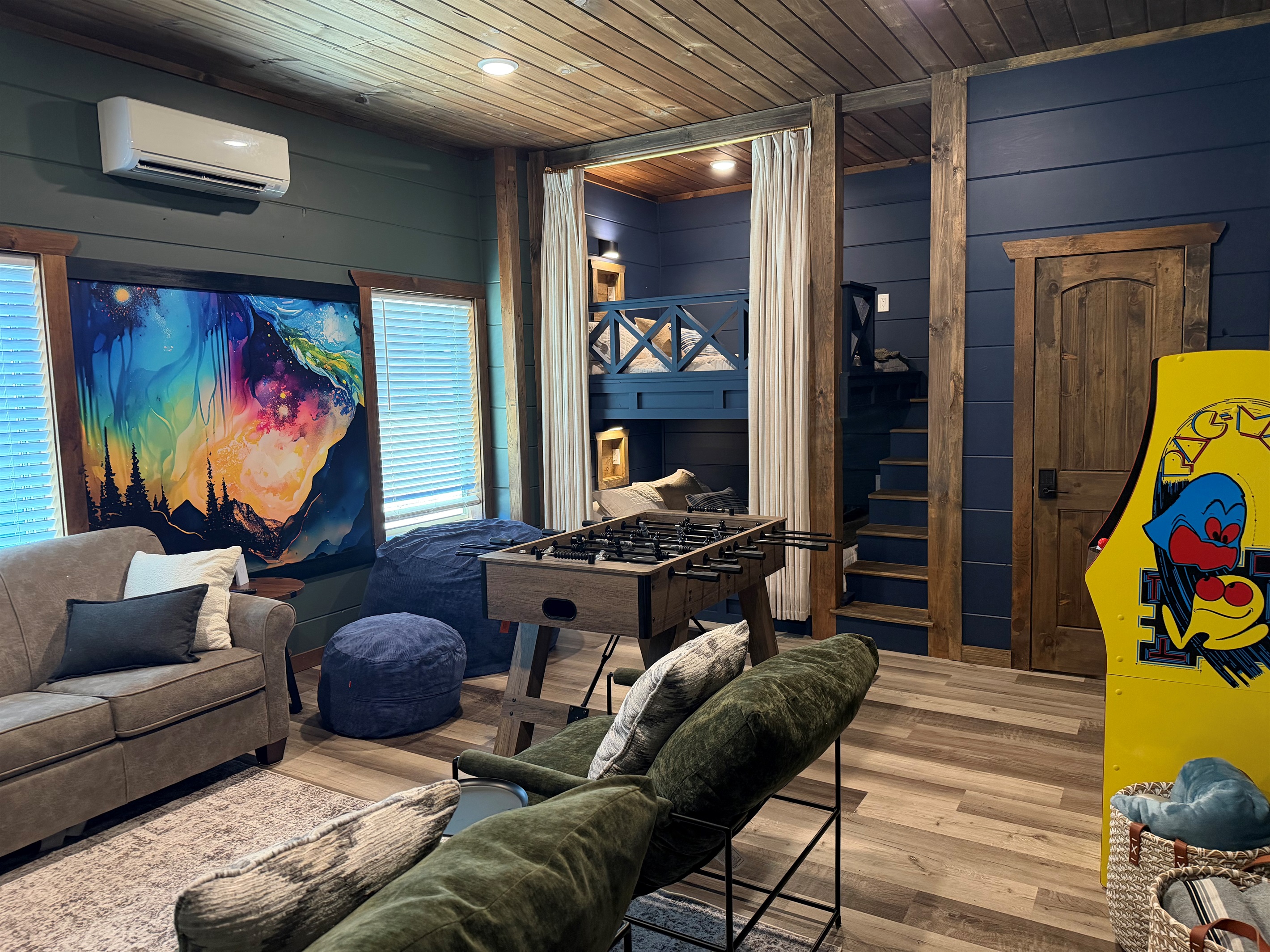 Recreation room with built-in Queen bunk beds, foosball, beanbag and smartTV