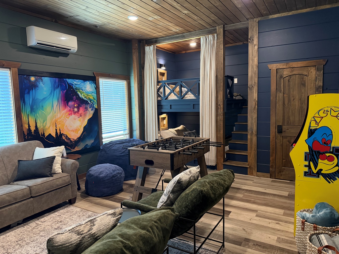 Recreation room with built-in Queen bunk beds, foosball, beanbag and smartTV