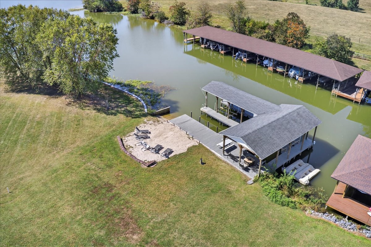 The perfect spot: sandy beach, boathouse, and quiet lake cove.