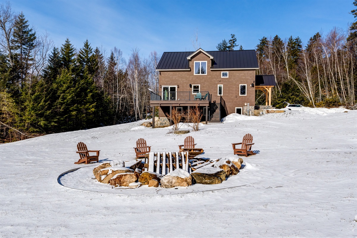 Large boulder fire pit with seating