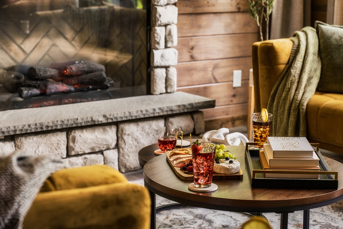 Stylish living room with plush seating & electric fireplace, perfect for family time