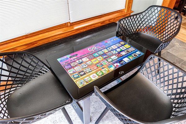 Infinity game table will be the gathering spot for multiple generations in the sun room with voer 400 games.
