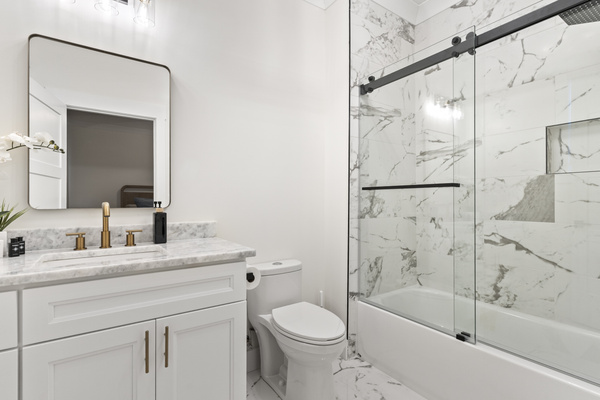 Full bathroom with Shower/Tub combo, bidet, soap, lotion, shampoo and conditioner.