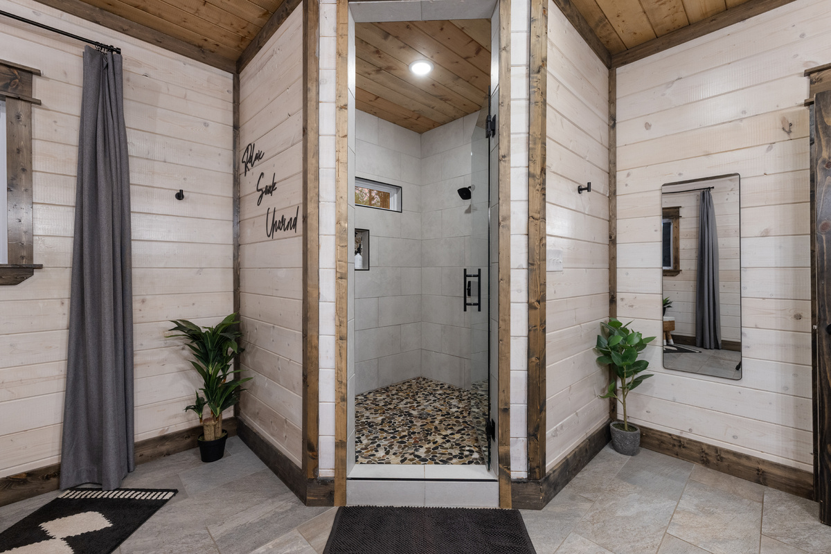 Step into the oversized walk-in shower with dual showerheads for one more spa-like touch before heading out to explore or staying right here all day.