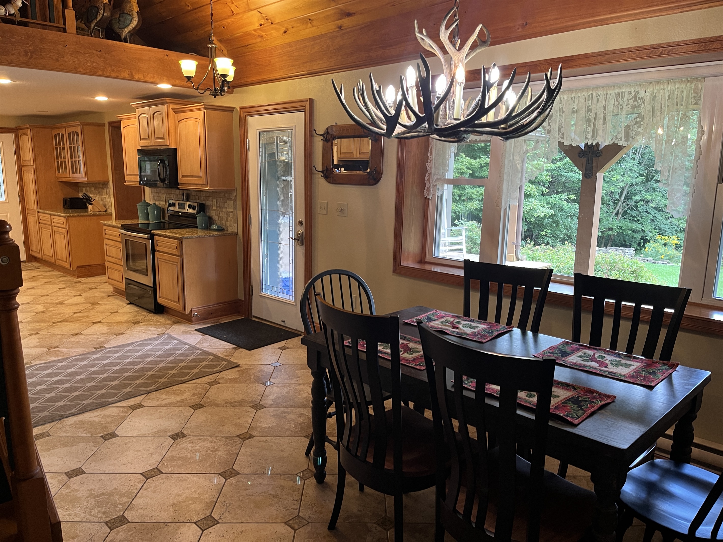 Dining area off kitchen with front porch access