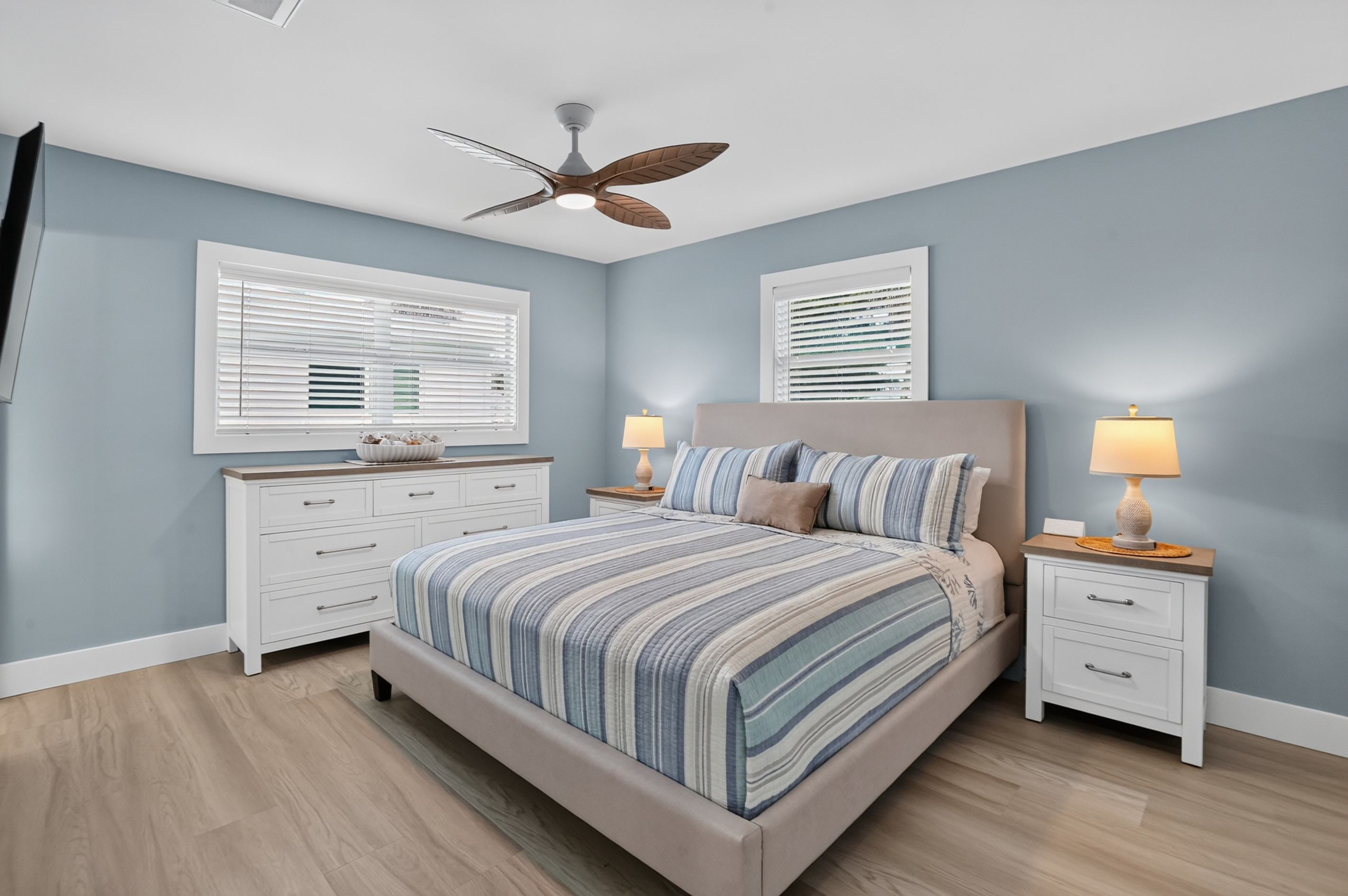 The spacious primary bedroom features a new king mattress, ample storage and a 50-inch smart TV.