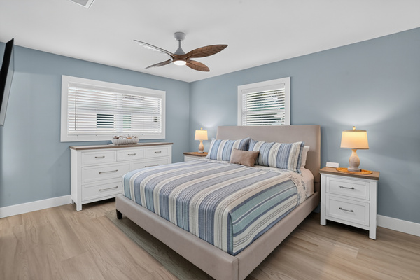 The spacious primary bedroom features a new king mattress, ample storage and a 50-inch smart TV.