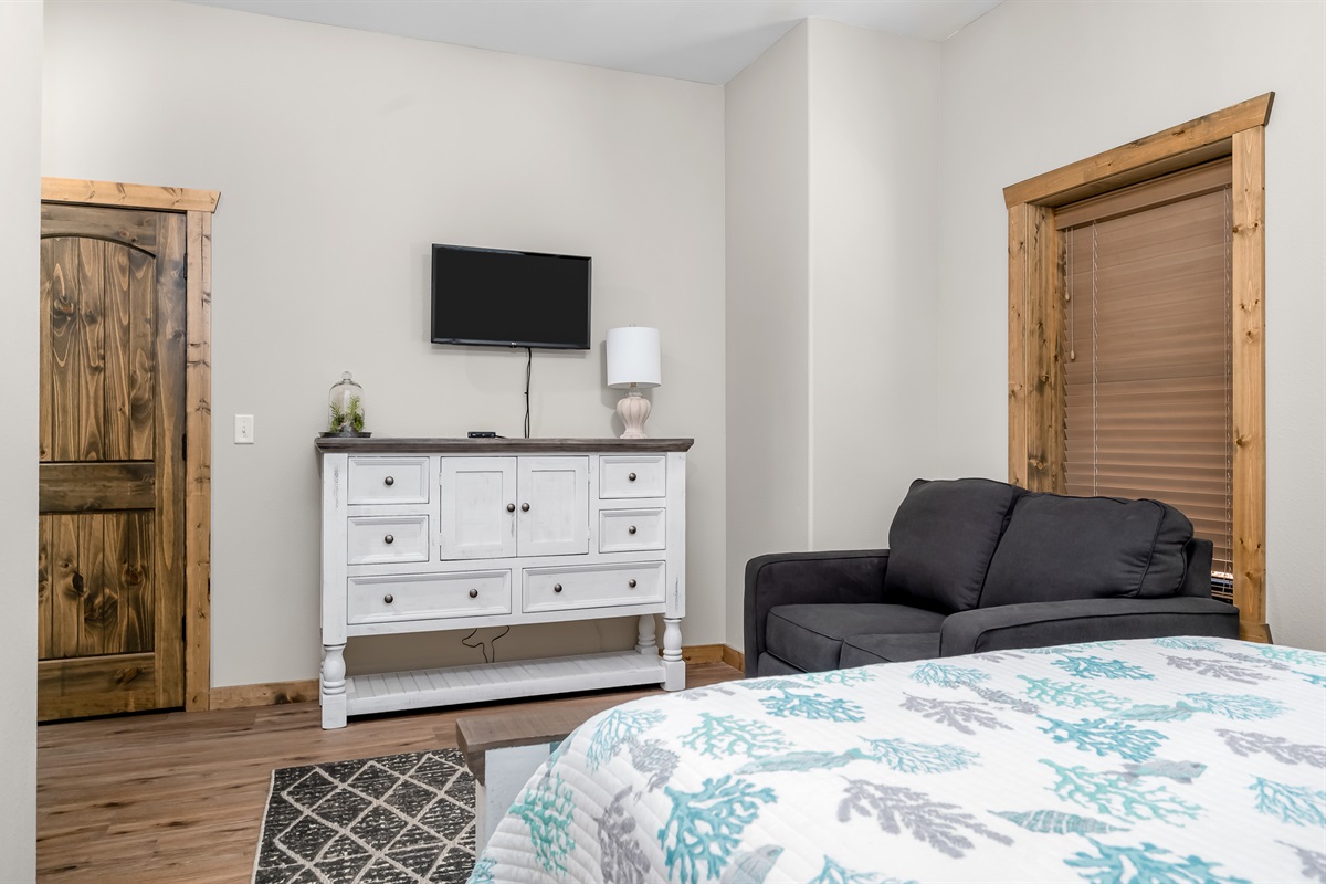 Lower level queen bedroom with sleeper sofa