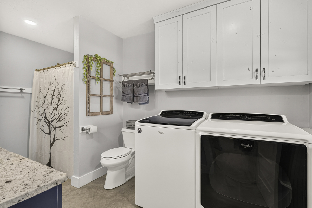 Laundry room/full bathroom on main level.