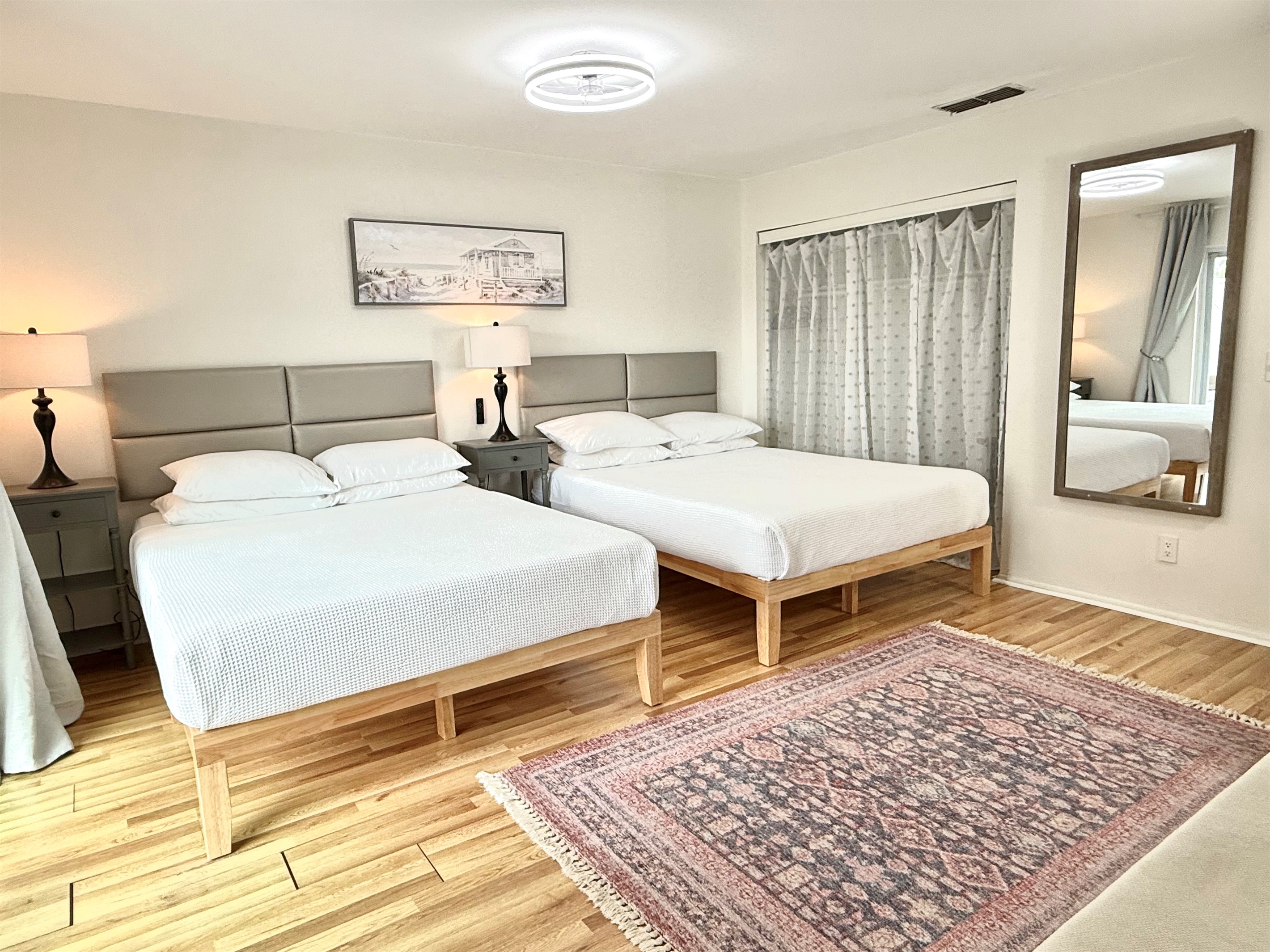 Master bedroom - 2 Queen size beds with memory foam mattresses and smart 65" TV.  En-suite (attached) bathroom.