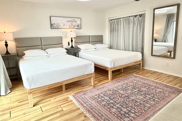 Master bedroom - 2 Queen size beds with memory foam mattresses and smart 65" TV.  En-suite (attached) bathroom.