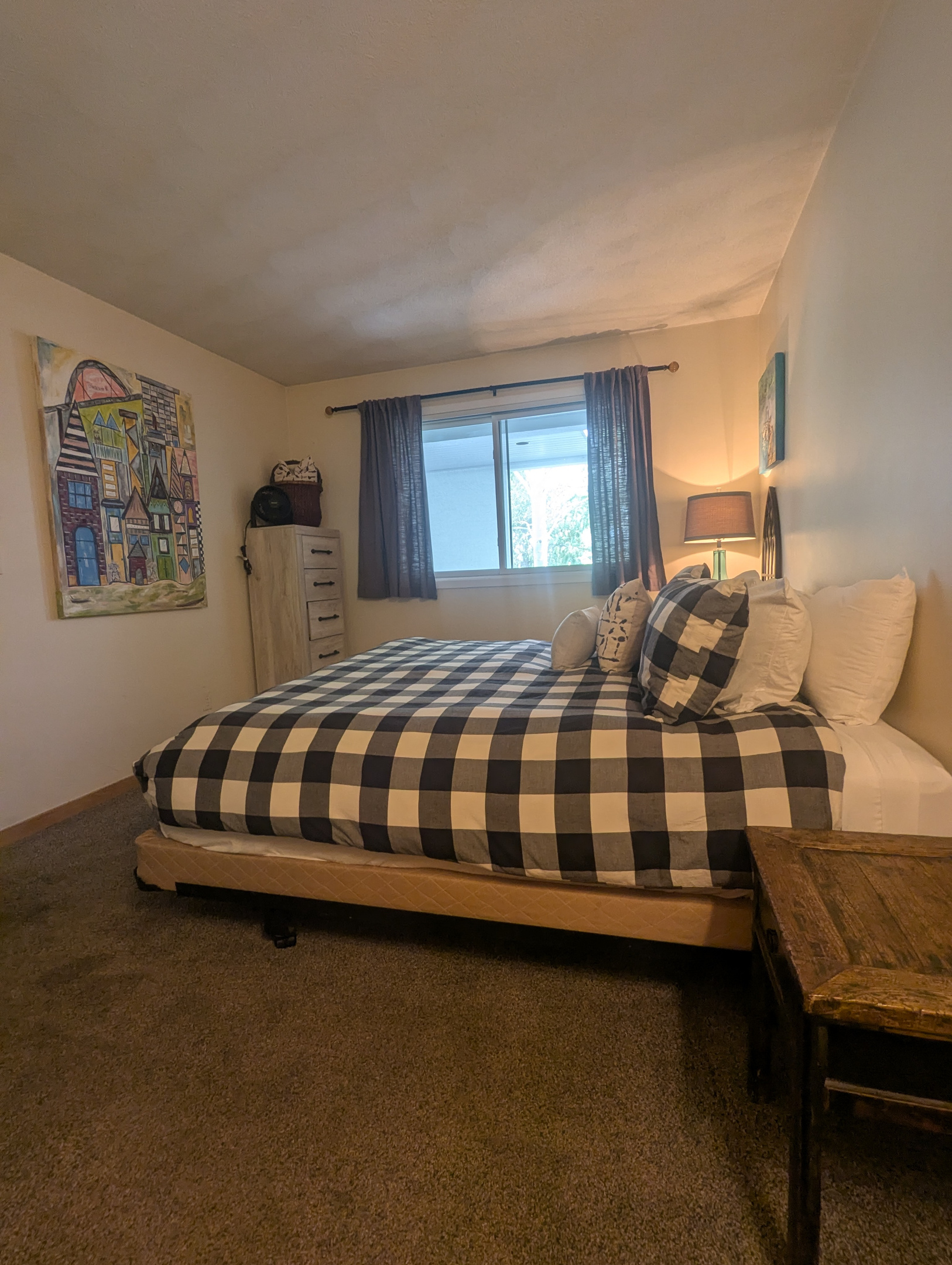 LIght and bright bedroom with shades for privacy