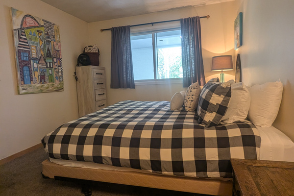 LIght and bright bedroom with shades for privacy