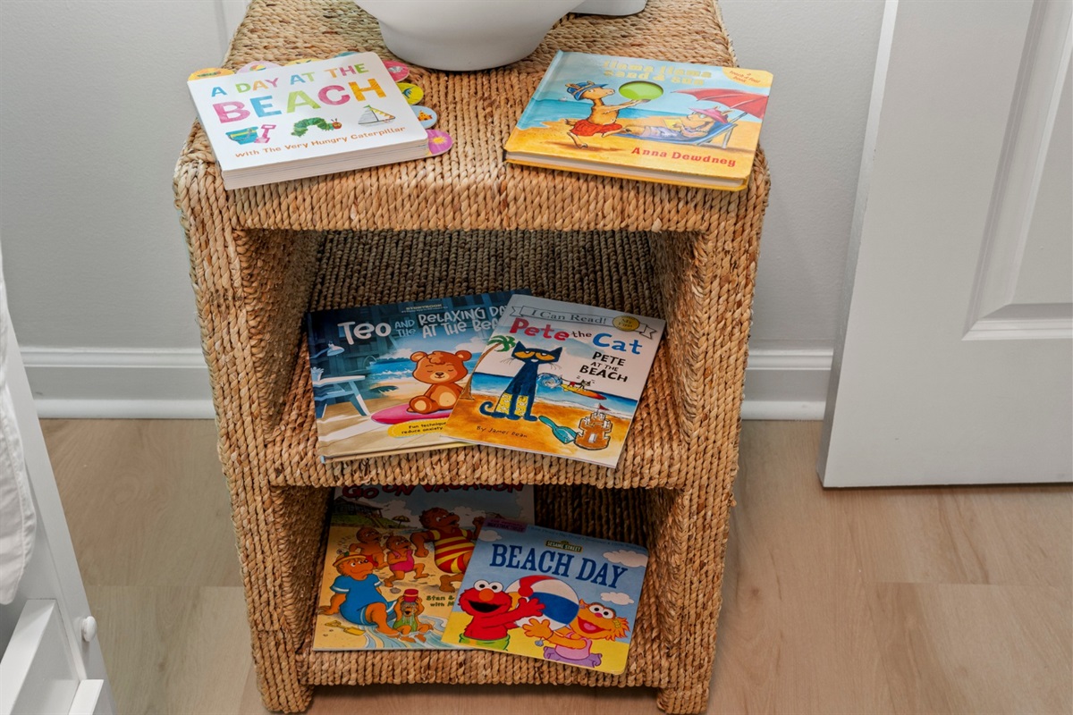 Wind down with beach-themed bedtime stories from a thoughtfully stocked shelf, giving little ones a cozy end to their day.