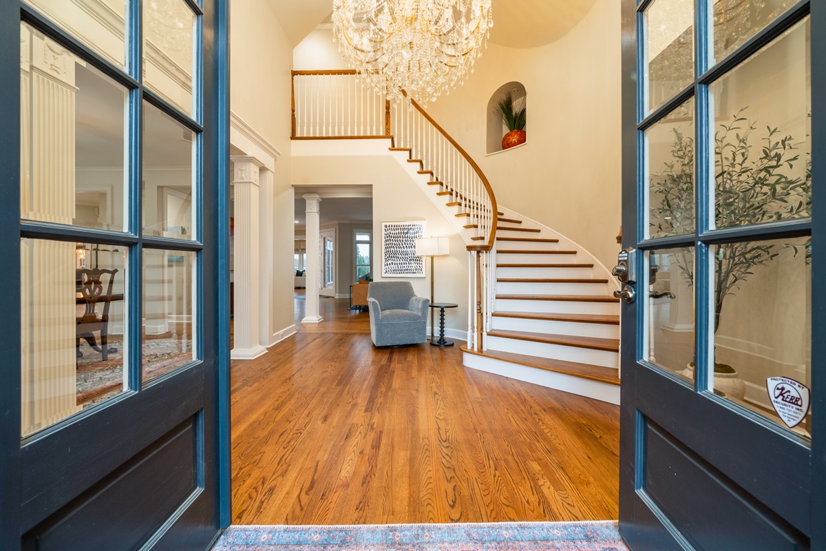 [Front Entrance] The Front Door Opens Up to your Luxurious Villa, and the Grand Stairwell that Leads you to the Five Bedrooms.