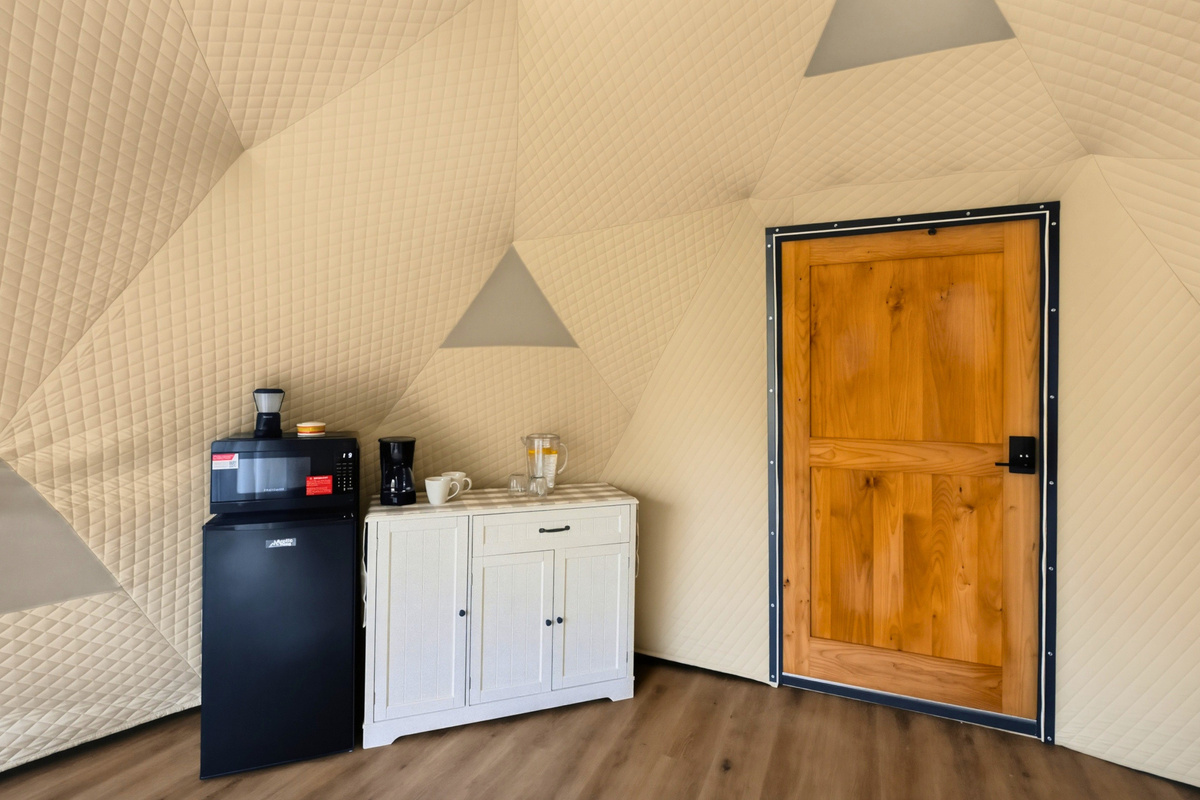 Enjoy convenient in-dome amenities, including a coffee maker, mini fridge, and microwave.