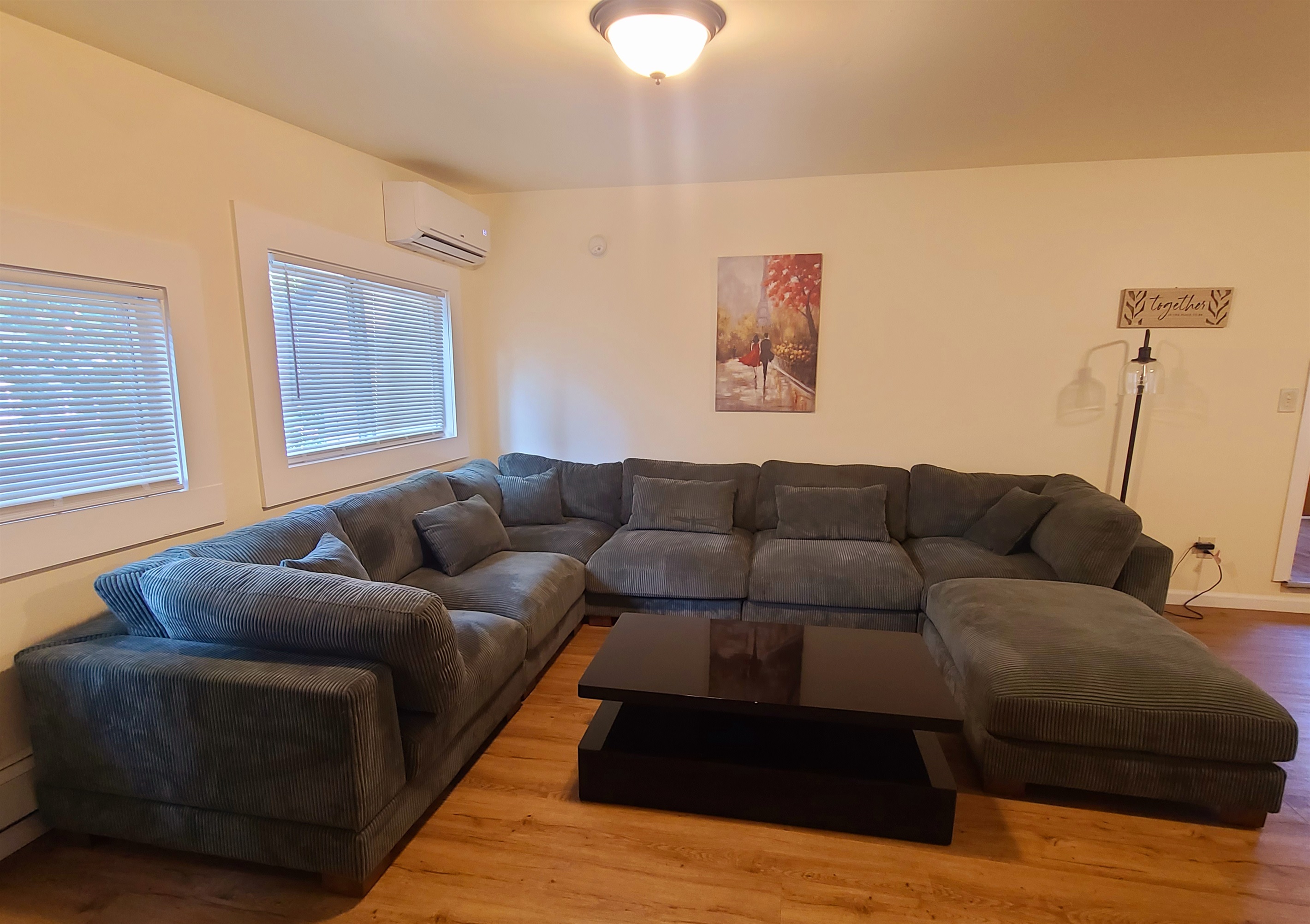 NEW LISTINGS - Large sectional in living room with SmartTV