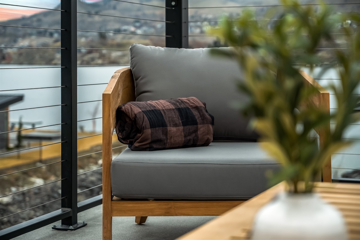 Roof top deck with lounge seating, fire table and dining table