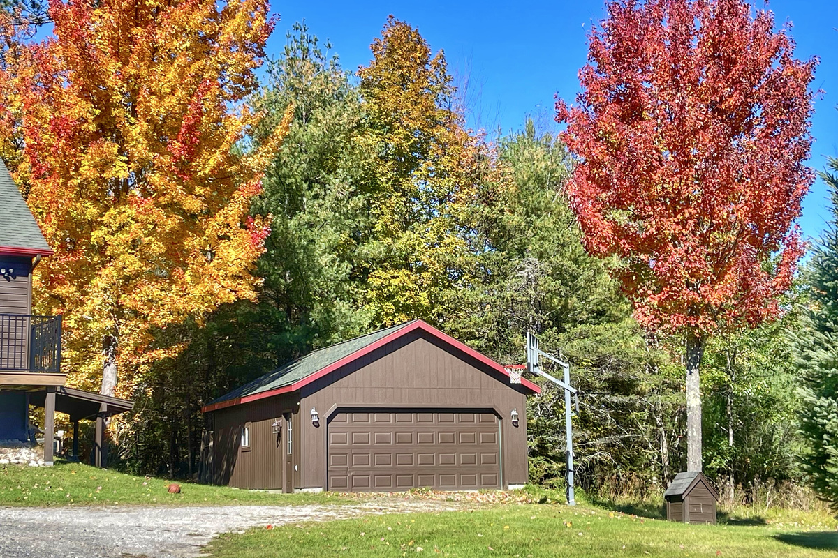 Adirondack Alpine Cabin offers ample parking plus a 2-car garage—perfect for keeping vehicles warm and snow-free during winter stays.