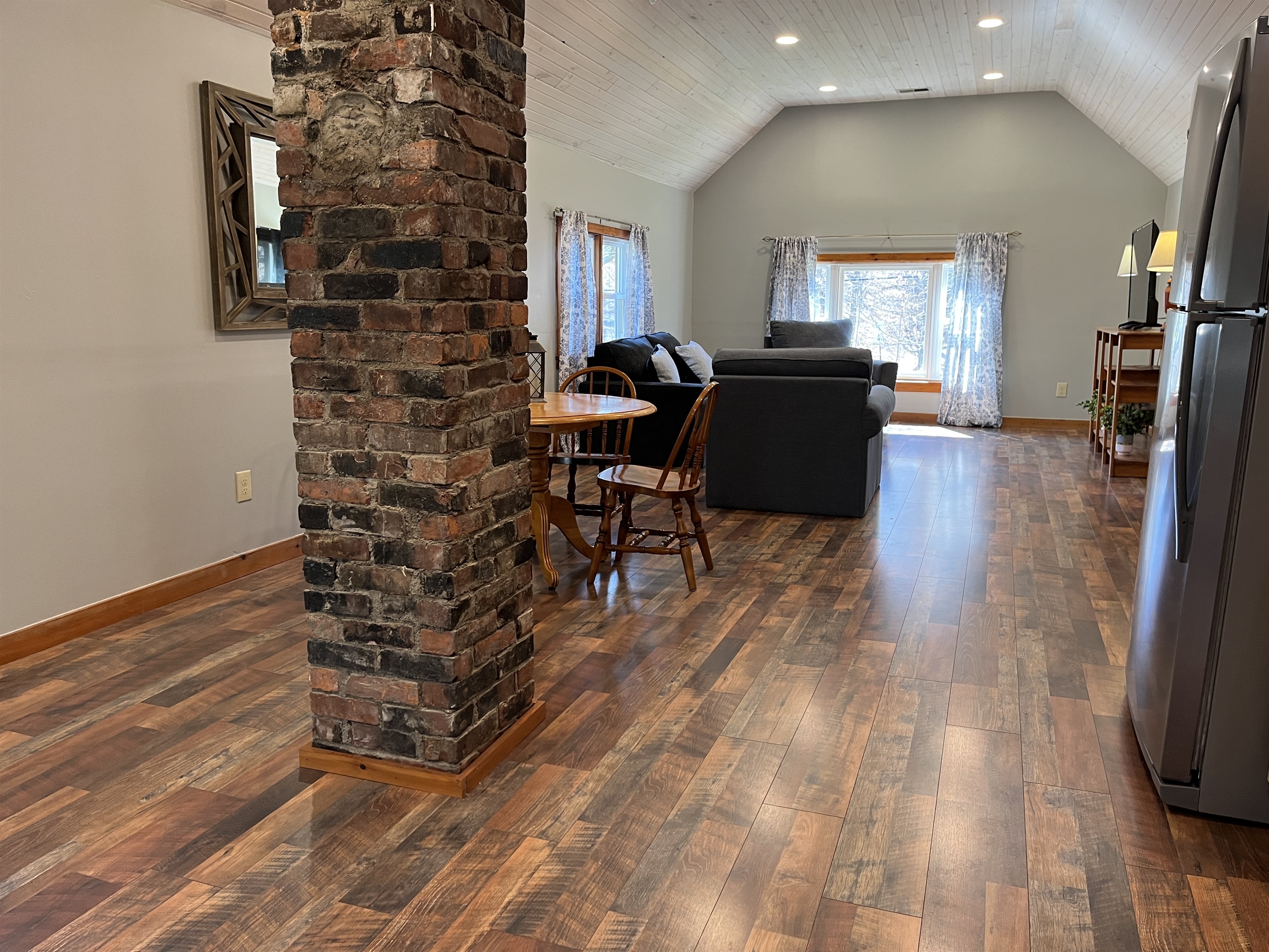 Original exposed brick chimney in kitchen area