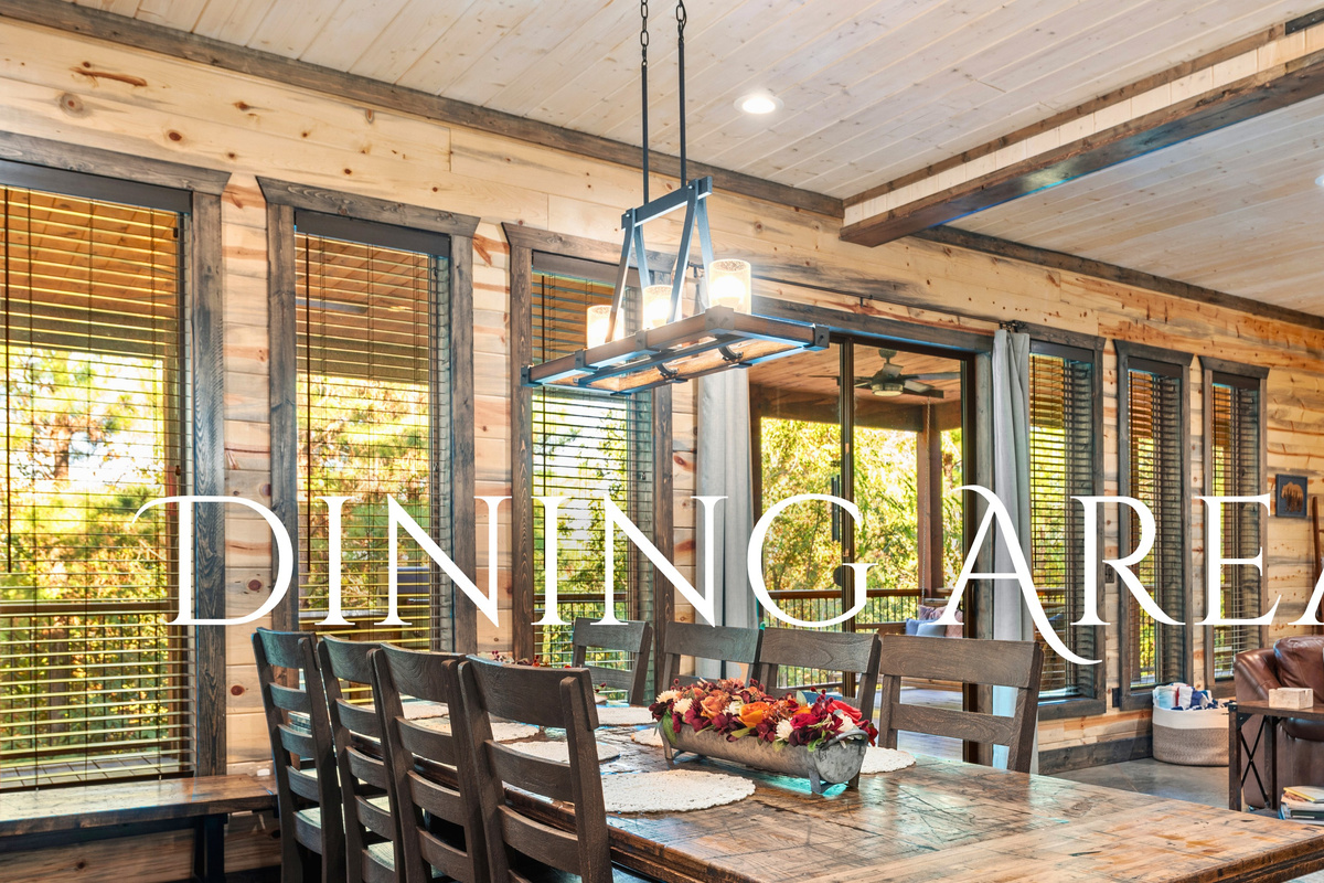 The dining area is perfect for family meals or a fun game night, with plenty of natural light and space for everyone to gather.