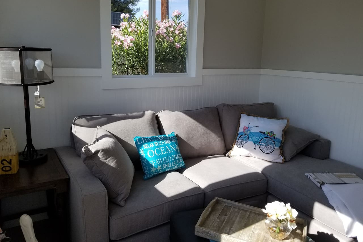 Backyard Garden Room – Comfortable private room with mini-split, TV, and workspace. Sleeps 1.