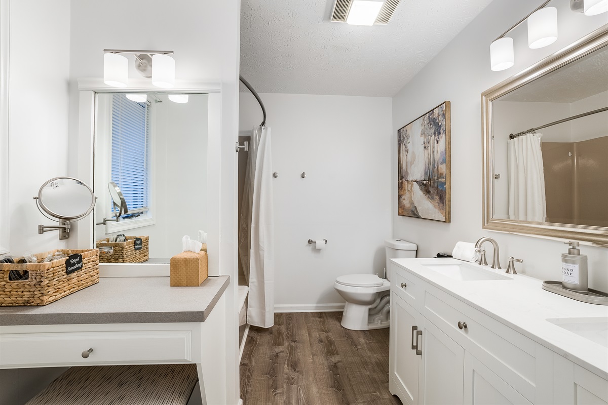 primary bath with separate make up counterand "forget something" basket