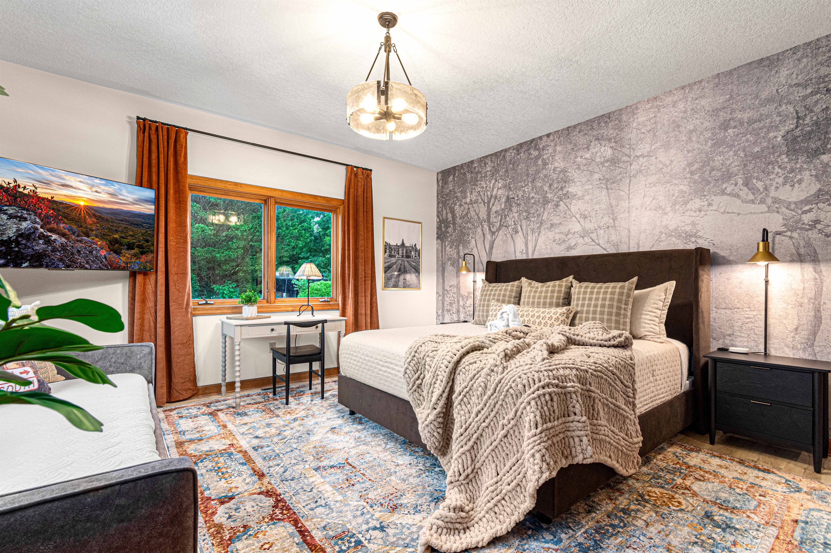 The Biltmore bedroom with king bed and day bed trundle has plenty of closet storage, which happens to be file cabinet deep - a nod to the professor who custom designed this home.